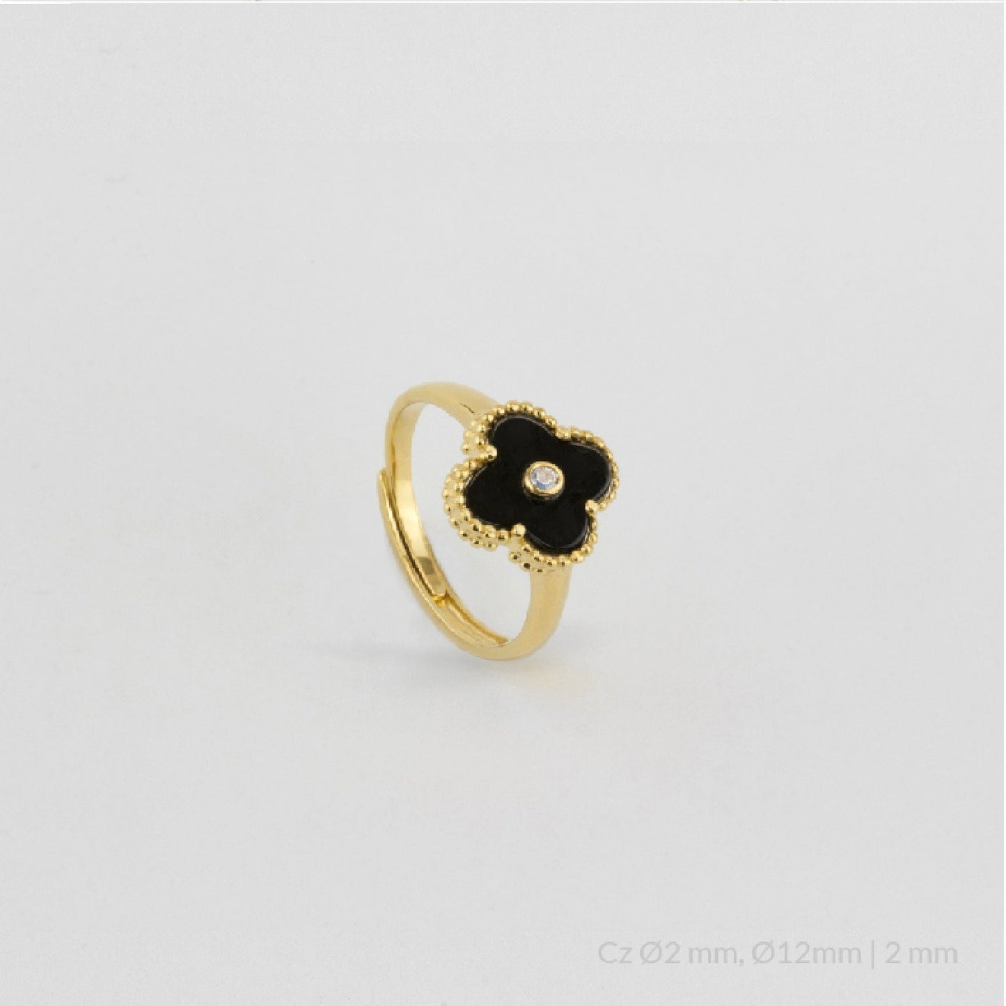 Anillo de Plata de Ley chapado en oro con flor en ónix negro y circonita blanca