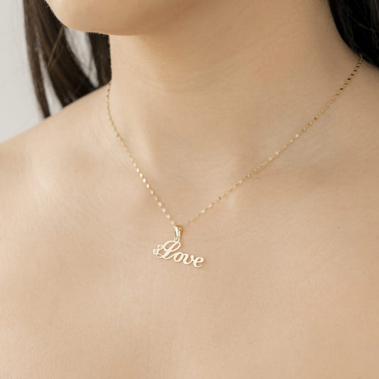 Colgante LOVE con Circonitas en Oro de 18 Ktes.